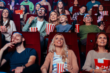 Cheerful family in movie theater.