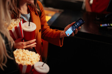 Woman checking seats for movie online.