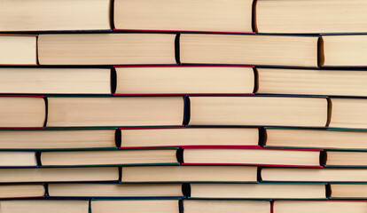 books stacked in the form of a wall