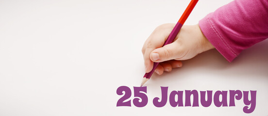 A child's hand writes 25 january in a lilac pencil. Banner with copy space
