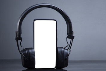 black headphones on smartphone music online concept, transparent mockup - 571542306