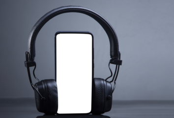 black headphones on smartphone music online concept, transparent mockup