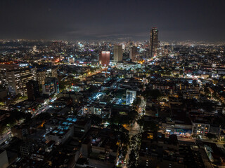 Obraz premium Beautiful aerial view of the capital of Mexico city at night.