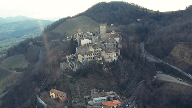 drone aeria sunsetl view of Vigoleno Castle , fortress village and hills, scenic panorama in Parma, Emilia Romagna , Italy.