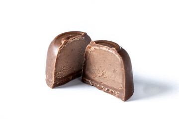 Cut Chocolate bonbons filled with chocolate cream isolated on white background