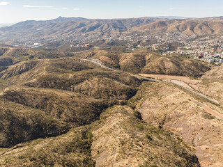 A beautiful aerial view of the endless mountains around the Mexican city of Guanajuato at sunset.
