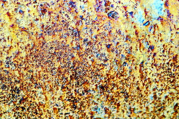 Old metal surfaces covered with rust and paint residue. Rust patterns as base and background.