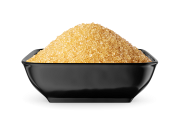 Dark brown granulated sugar in black bowl isolated on white. Front view.