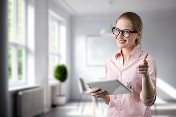 Young smart  business woman holding modern digital tablet
