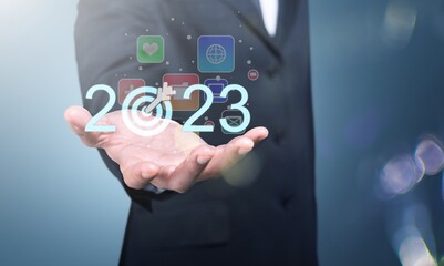 2023 concept, business person hold numbers with target