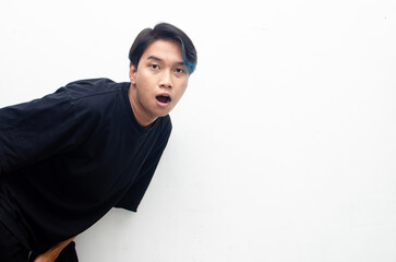 wow shocked expression of young asian man in peek a boo hair.