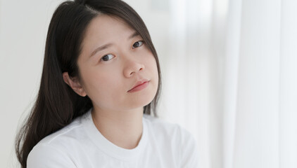 Asian woman in white T-shirt