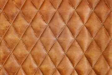 Naklejka premium Leather brown sofa background with checkerboard pattern