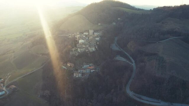 drone aeria sunsetl view of Vigoleno Castle , fortress village and hills, scenic panorama in Parma, Emilia Romagna , Italy.