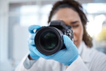 Camera, photography and lens with black woman in forensics laboratory for investigation, crime...