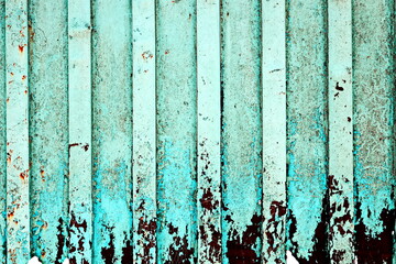 Old metal surfaces covered with rust and paint residue. Rust patterns as base and background.