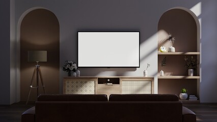 Dark wall in night time have tv on wood cabinet in living room with sofa.