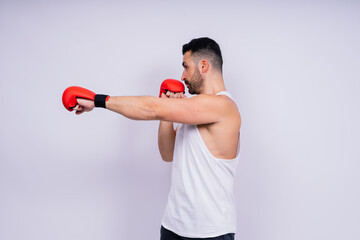 Young caucasian handsome man isolated on white background with boxing gloves