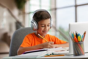 Young school student study at home