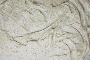The texture of a light green body scrub with aloe, body cosmetics. Flat lay