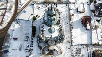 a beautiful old baroque church with a bell tower in the village of Bykovo near Moscow in winter shot from a drone