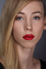 portrait of young woman on dark background