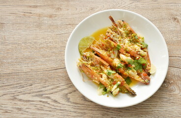steamed river shrimp dressing spicy and sour lemon sauce on plate