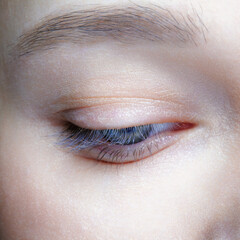 Closeup macro shot of human female eye. Woman with natural face beauty makeup