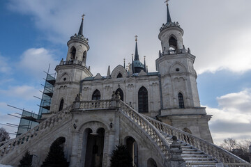 Fototapeta na wymiar beautiful stone old church in boroque style on a sunny winter day in Bykovo