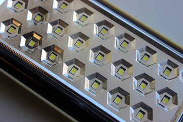 Pattern of LED light diodes in a rows on mirror panel for backlight closeup stock photo
