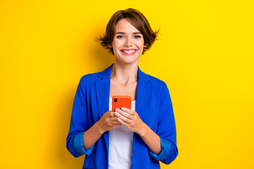 Photo of positive millennial lady use smart gadget texting business partners via network isolated bright color background