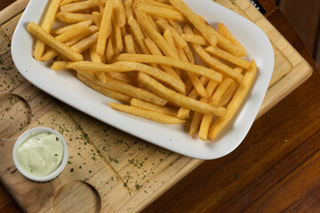 fingers breaking a crispy potato chip, closeup