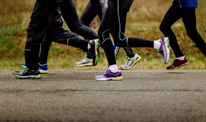 leg runners in leggings run in group marathon