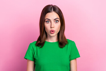 Portrait of optimistic gorgeous nice woman with straight hairdo wear green t-shirt astonished staring isolated on pink color background