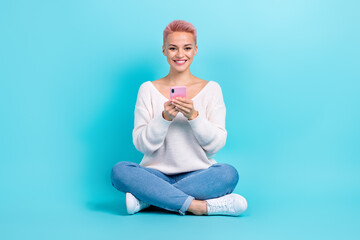 Fototapeta na wymiar Full length photo cadre of positive attractive pretty woman smartphone user browsing smartphone twitter blog isolated on blue color background
