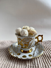 Crispy coconut candies in a cup