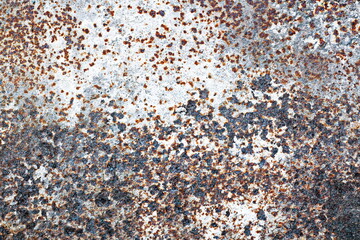 Old metal surfaces covered with rust and paint residue. Rust patterns as base and background.