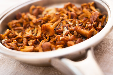 traditional dishes of Eastern European cuisine. Fried chanterelles in pan