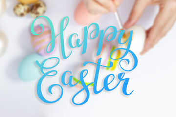 Bright easter eggs with happy Easter lettering, holiday concept. Selective focus