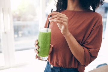 Hands, smoothie and straw with a black woman drinking a health beverage for a weight loss diet or...