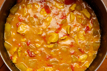 Close up of chicken curry with potatoes and peppers