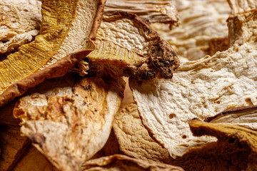 Close up of dried porcini mushrooms. Food and wooden background. Rustic style.