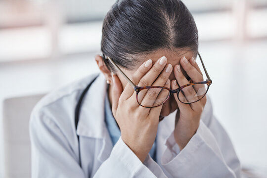 Burnout, stress or doctor woman with headache in office from depression, mental health or anxiety medical review. Tired, pain or sad nurse frustrated, angry or depressed from medicine report mistake