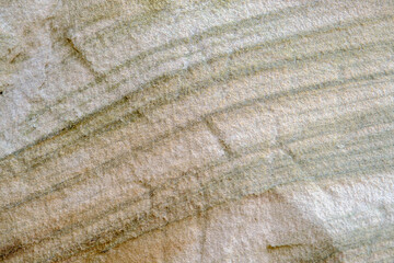 Grey and brown genuine sandstone background, real beach rock pattern