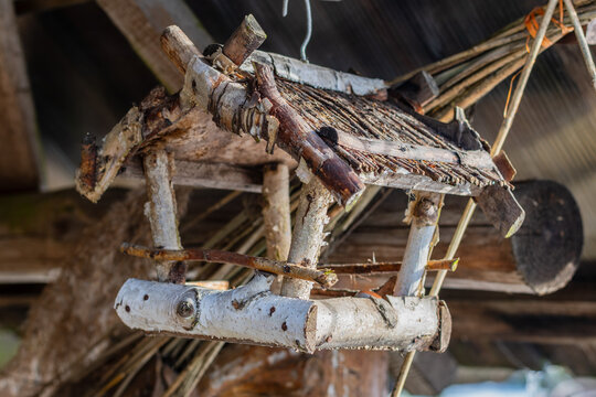 Beautiful wooden bird house made by branches of a birch tree