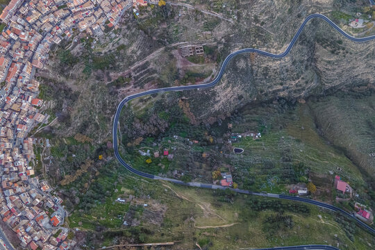 Aerial view of a mountain road driving along the hill in Centuripe, Enna, Sicily, Italy.
