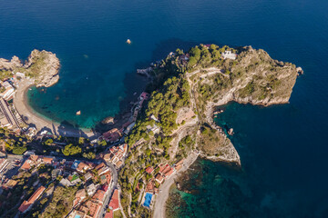 Aerial view of the Blue Cave (Grotta Azzurra) on the promontory along the coastline in Taormina, Messina, Sicily, Italy.