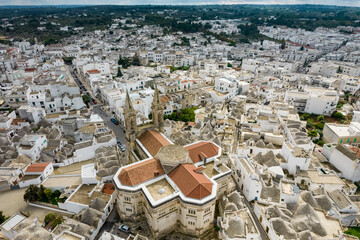 Aerial view of Basilica of Saints Cosmas and Damian, Alberobello, Puglia, Italy.