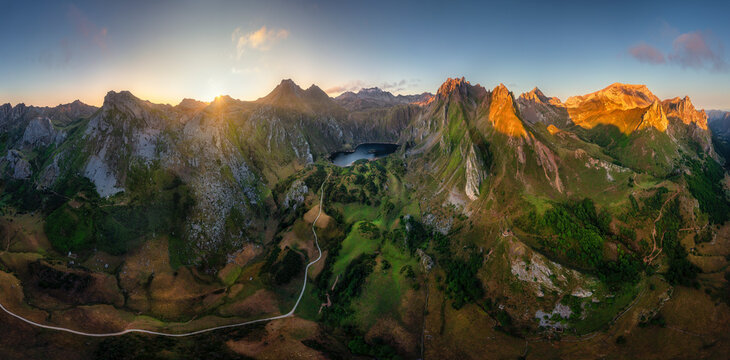 Panoramic aerial view of a mountain range landscape at sunset along Valle lake, Somiedo, Asturias, Spain.