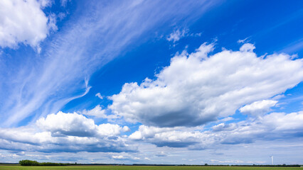 Bright blue skies over a distant narrow stretch of land in Germany's Brandenburg region.